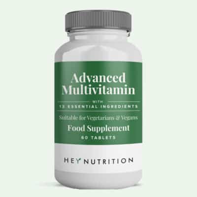 advanced multivitamin bottle on a green background