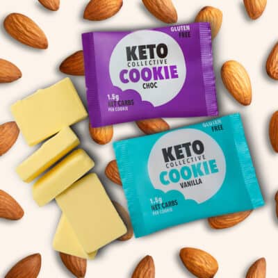 2 keto cookies on a cream background with almonds and real butter