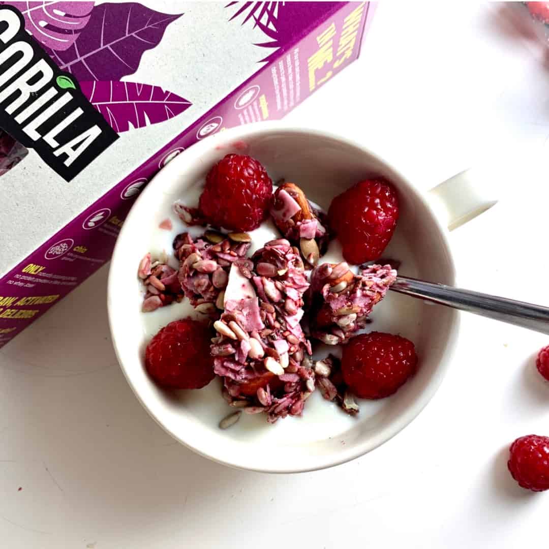 Raw Gorilla - Berry Granola 2 raw gorilla berry granola organic keto in a bowl with almond milk and raspberries